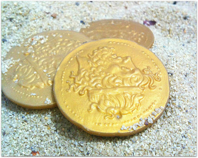 gold coins found in the sand